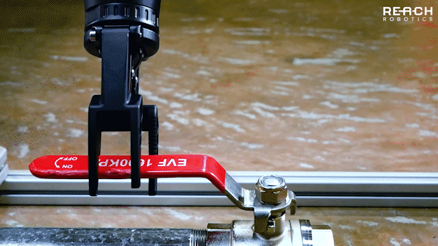 Reach Bravo 7 robotic arm turning an industry standard valve using its powerful kinematics engine